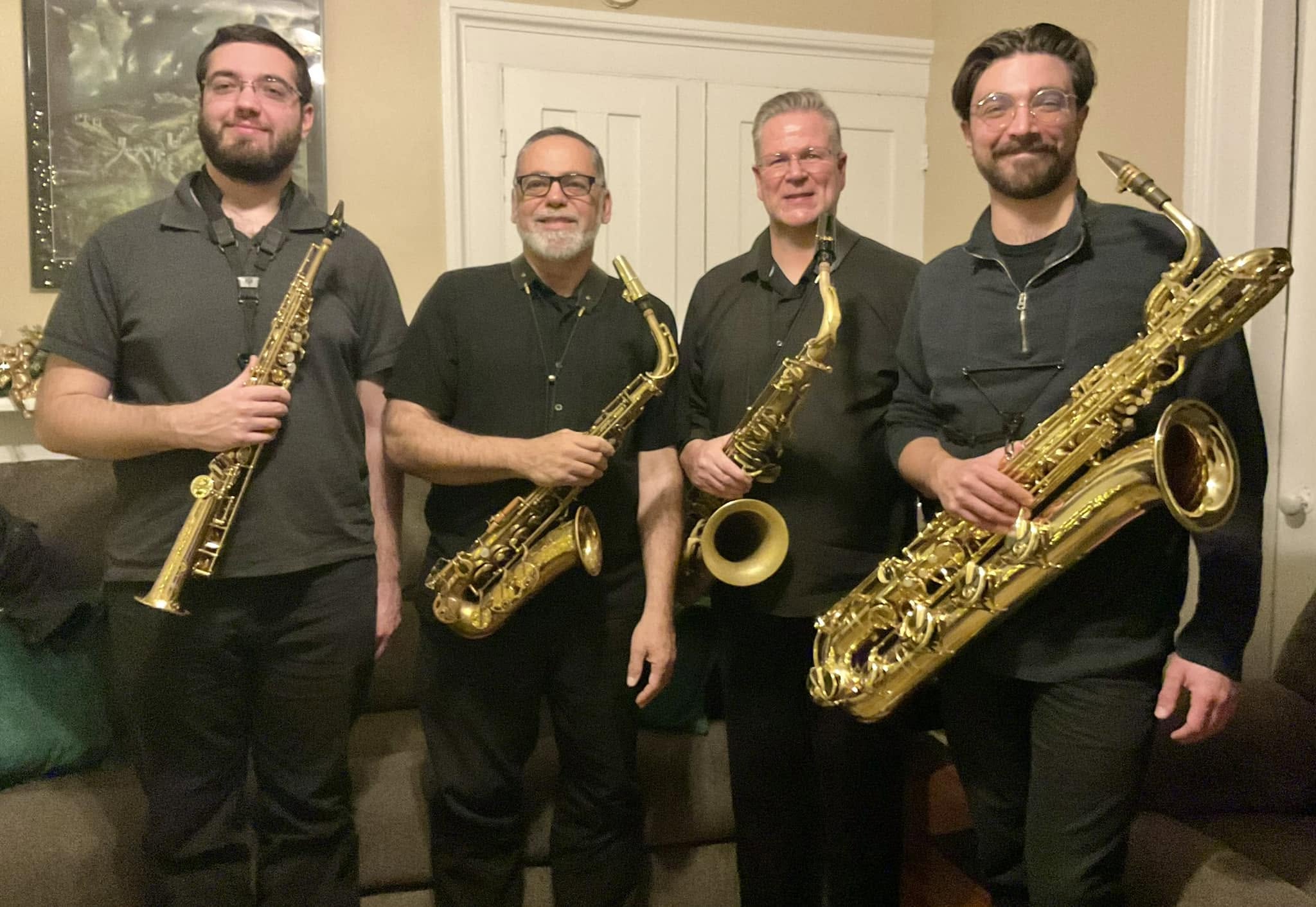 Infinity Saxophone Quartet performing at a home concert series