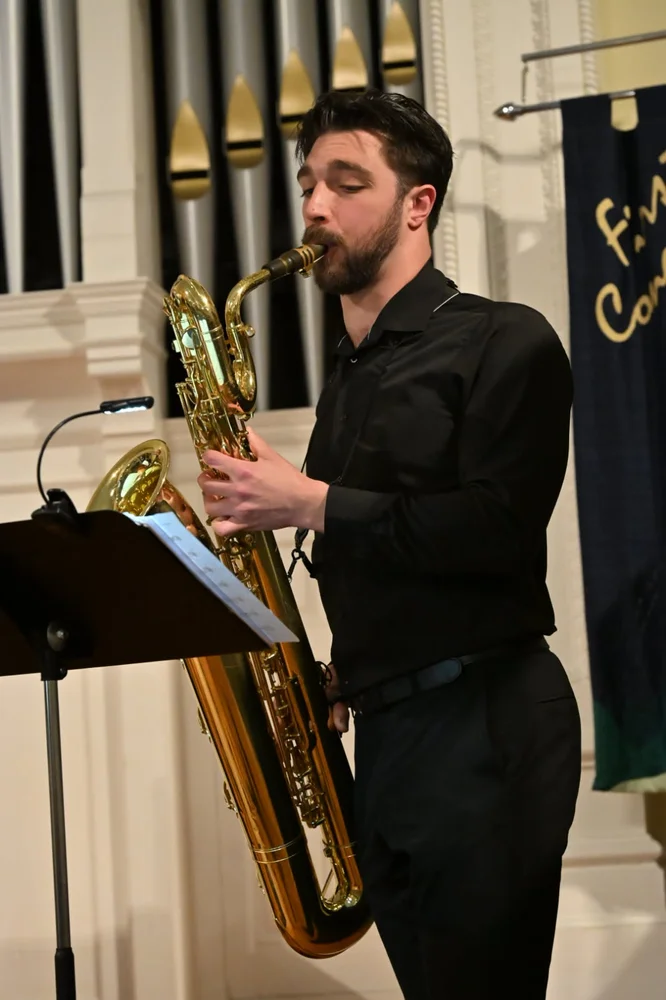 Matt Schmidt headshot, baritone saxophone